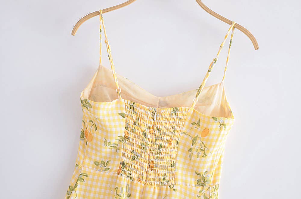 A strappy dress with floral prints and ruffles