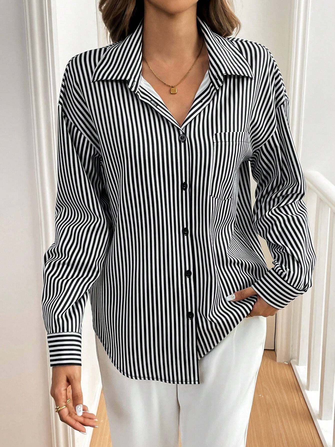A striped printed long-sleeved shirt with a bow