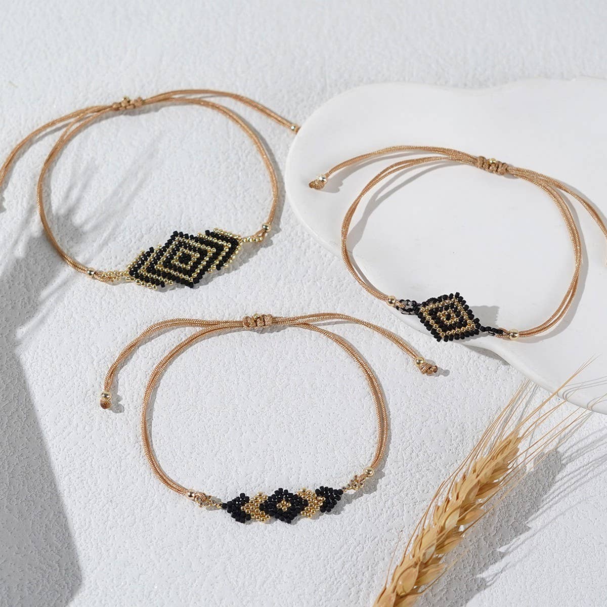 BRAIDED ARROW RICE BEAD BRACELET SET OF THREE_CWMM3884