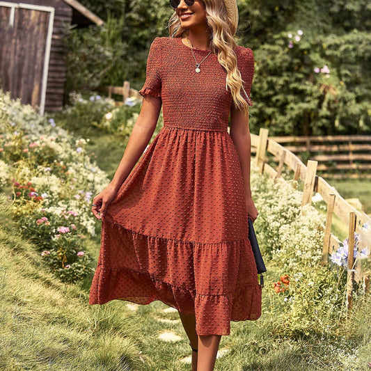 FLAUNTING A FLOWING SLIM-FIT DRESS